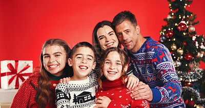 Buy stock photo Smile, christmas and portrait of family in studio with tradition, festive or holiday celebration. Happy, bonding and children with parents for xmas season together with decorations by red background.
