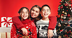 Christmas, hug and portrait of sibling children in studio for celebration or tradition. Family, presents or tree with brother and sisters isolated on red background for holiday season embrace
