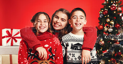 Buy stock photo Christmas, hug and portrait of sibling children in studio for celebration or tradition. Family, presents or tree with brother and sisters isolated on red background for holiday season embrace