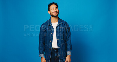 Buy stock photo Happy, fashion and man on blue background thinking for trendy style, clothes and confidence. Mockup space, studio and person with positive attitude, smile and outfit ideas in denim for aesthetic