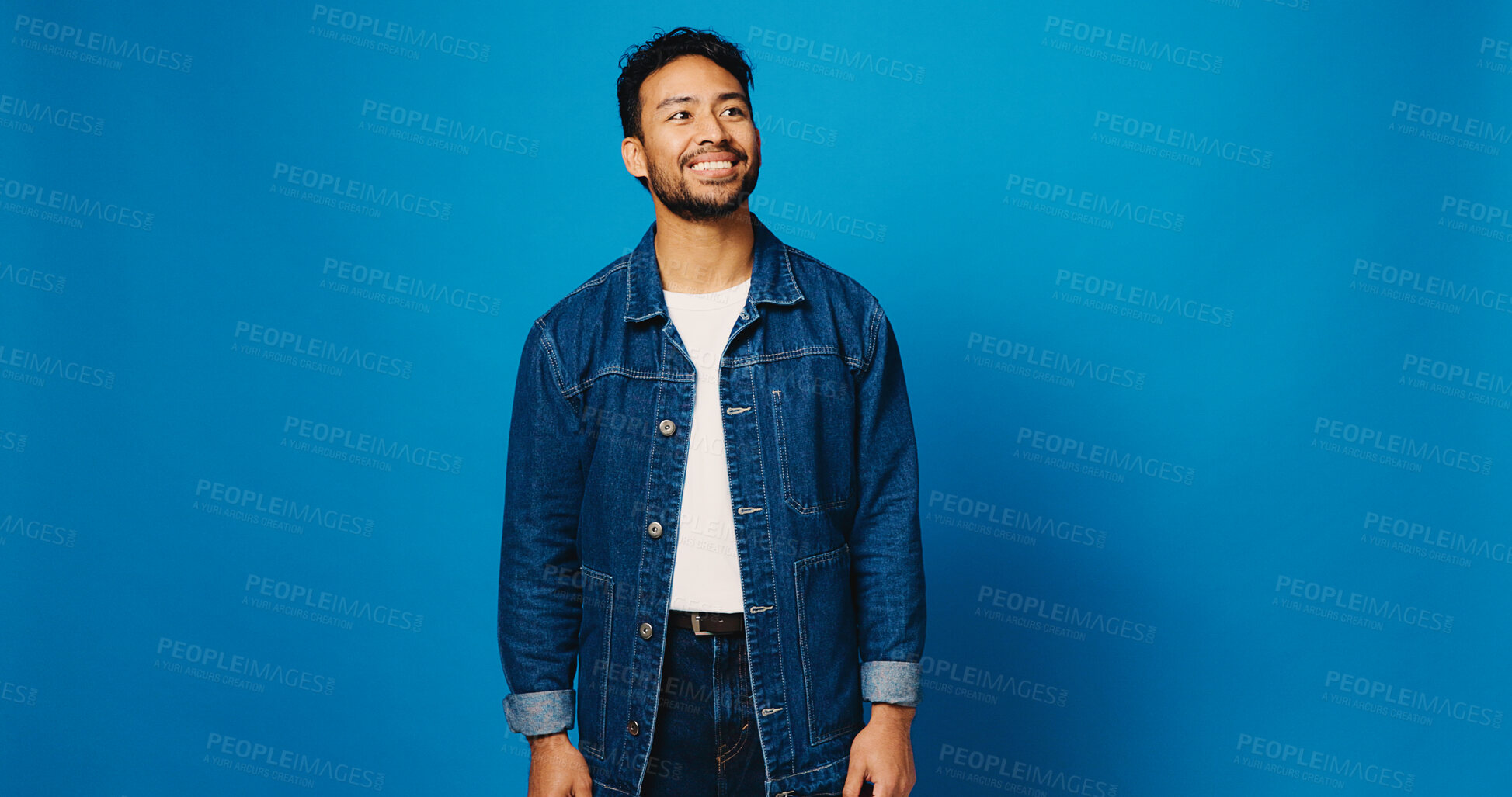 Buy stock photo Happy, fashion and man on blue background thinking for trendy style, clothes and confidence. Mockup space, studio and person with positive attitude, smile and outfit ideas in denim for aesthetic