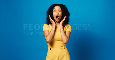 Buy stock photo Woman, surprise and portrait with reaction to news in studio, announcement or expression on blue background. Mockup space, wow or shock with female person, alert or mindblown with notification