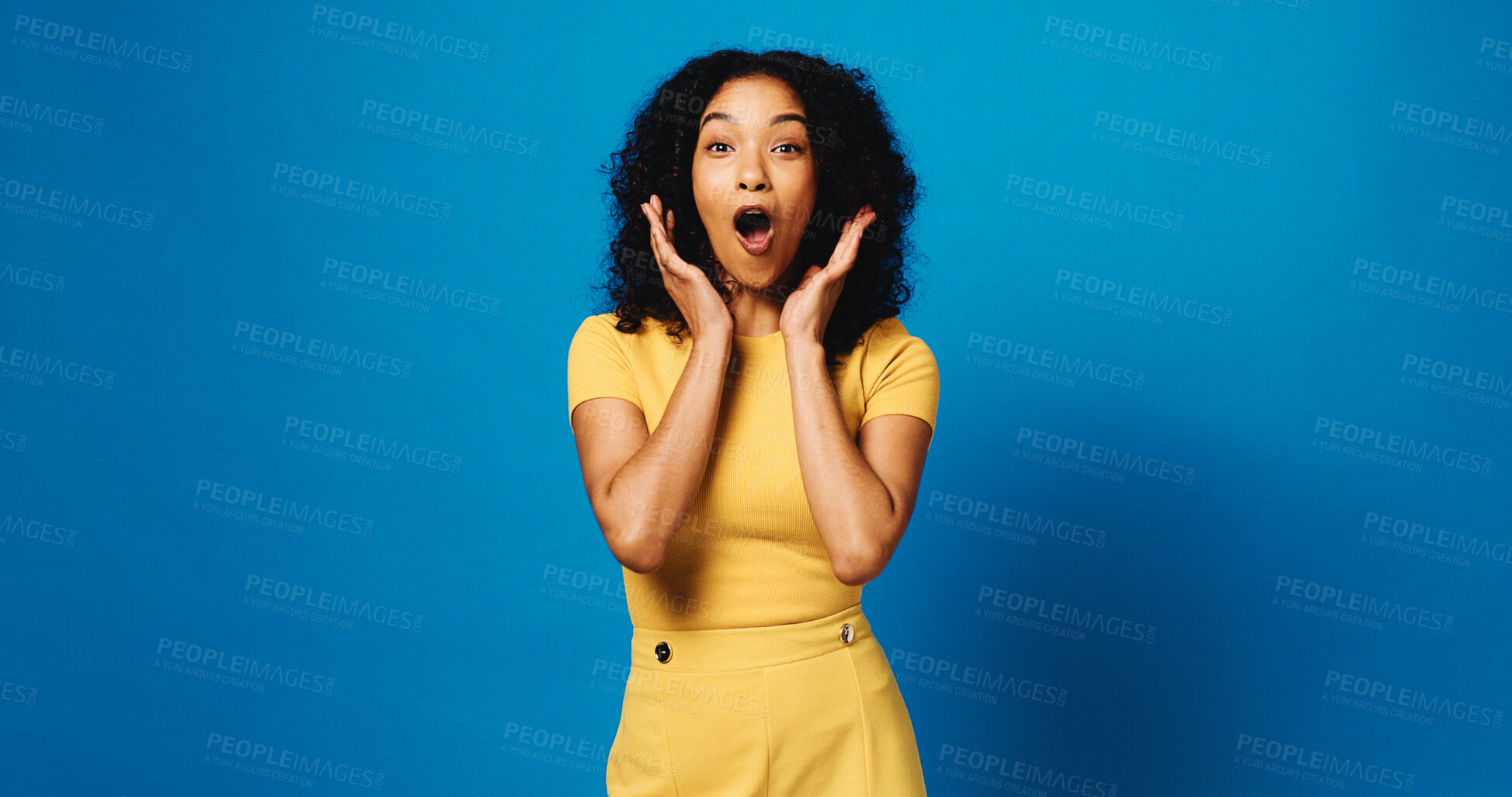 Buy stock photo Woman, surprise and portrait with reaction to news in studio, announcement or expression on blue background. Mockup space, wow or shock with female person, alert or mindblown with notification