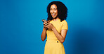 Laughing, woman and texting with smartphone, studio and communication with tech and blue background. Happy, person and funny joke on social media, mockup space and humor for message on mobile app