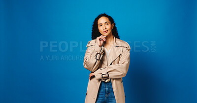 Buy stock photo Thinking, fashion designer and woman in studio, choice and problem solving on blue background. Person, space and creativity for project, decision and brainstorming with planning, ideas or solution