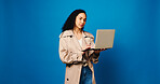 Clothes, laptop and woman fashion designer in studio for market research of trendy style on space. Aesthetic, computer and small business with design employee isolated on blue background mockup