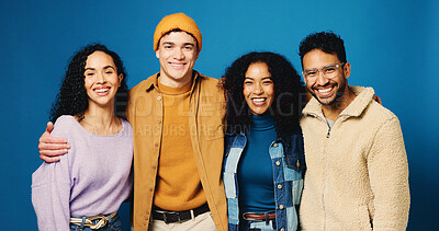 Buy stock photo Hug, students and portrait of friends in studio for college application, enrollment and scholarship. Happy, blue background and people with pride for university, school and education opportunity
