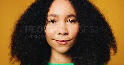 Buy stock photo Happy, hair care and portrait of woman in studio with afro, natural or confidence for growth. Smile, pride and face of female person from Colombia with shiny curly hairstyle by yellow background.