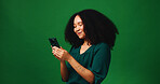 Cellphone, happy and woman in studio with networking, communication or texting on mobile app. Mockup space, technology and person with phone for chatting, contact or social media by green background.