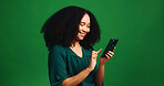 Studio, message and woman with smartphone, happy and communication with contact on mobile and space. Read, social media and person with smile for digital chat, green background and texting with tech