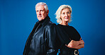 Fashion, studio and portrait of senior couple for trendy outfit, cool clothes and outfit together. Marriage, space and mature man and woman with attitude, confidence and pride on blue background