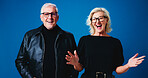 Happy, glasses and portrait of senior couple for optometry deal, pensioner discount and optician sale. Excited, laugh and man with woman on blue background with frames, prescription lens and eyewear