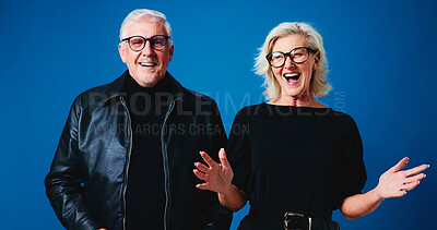 Buy stock photo Happy, glasses and portrait of senior couple for optometry deal, pensioner discount and optician sale. Excited, laugh and man with woman on blue background with frames, prescription lens and eyewear