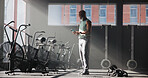 Smartphone, fitness and black man in gym, internet and digital app to track progress. Mature person, cellphone or health center with equipment, connection or training facility with message to contact