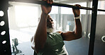 Fitness, man and pull up exercise at gym for shoulder strength, muscle mass and bodybuilding. Bodybuilder, mature black person and power training on workout bar for core development and performance