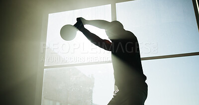 Buy stock photo Fitness, man and workout with kettlebell in gym for health, wellness or power with flare. Weightlifting, strength training or bodybuilder swing equipment for exercise or strong muscle with silhouette