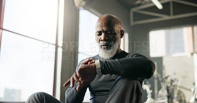 Buy stock photo Smart watch, fitness and mature man in gym for tracking exercise, training and workout progress. Sports, recovery and African person rest with digital tech for wellness app, performance and health