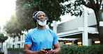 Athlete, black man and listening to headphones, outdoor and streaming music with smartphone and app. Happy, mature person and mobile for playlist on website, fitness and smile for album or song