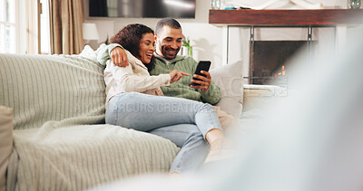 Buy stock photo Happy, laugh and couple with phone on sofa for social media, online message and connection. Home, weekend and man with woman on smartphone for reading news, notification and bonding in living room