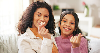 Buy stock photo Finger heart, portrait and woman with daughter on sofa in living room of home for gratitude or love. Emoji, hand gesture and smile of girl child with mother in apartment together for family bonding