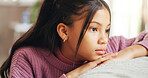 Home, thinking and girl with depression, child and sad with anxiety, reflection and foster care trauma. Apartment, adoption and kid on sofa, lonely and stress with mistake, mental health or abandon