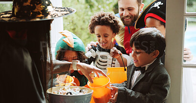 Buy stock photo Children, woman and sweets at door on halloween for tradition, support and trick or treat. Holiday, neighborhood kids and happy with bucket at house for candy collection, fantasy dress up or festival