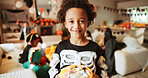 Halloween, portrait and boy with bucket, kid and smile with celebration, giving or holiday. Skeleton costume, basket or child with tradition, sweets container or home with happiness or showing treats