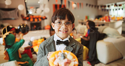 Buy stock photo Halloween, portrait and boy with basket, child and smile with candy party, home and holiday. Costume, bucket and kid with happiness, sweets container and giving with celebration, collection and pride