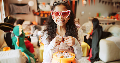 Buy stock photo Halloween, portrait and girl with basket, kid and excited with celebration, home and happiness. Dress up, bucket and child with smile, sweets container and giving with costume, tradition and holiday