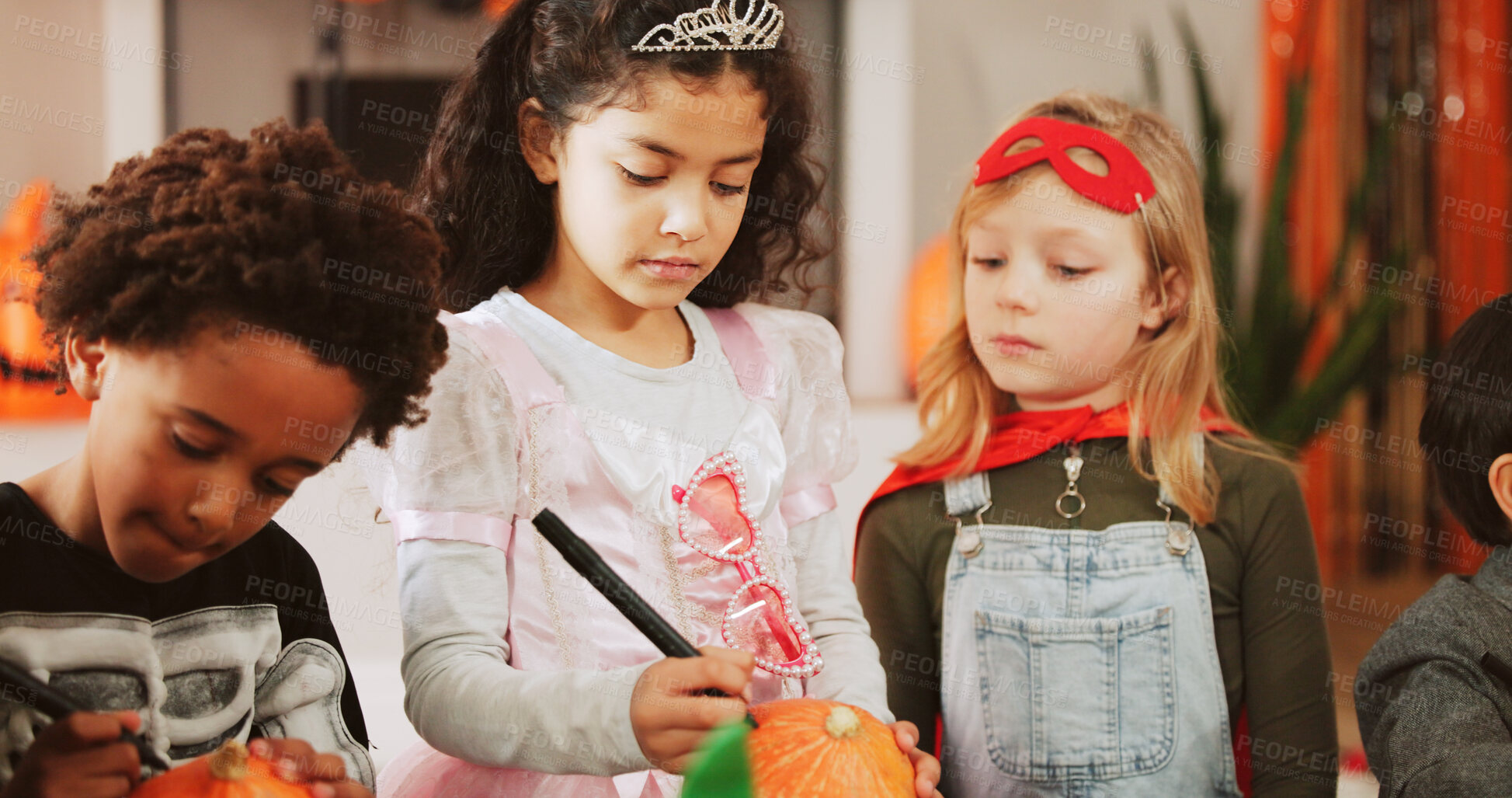 Buy stock photo Halloween, kids and girls with pumpkin, drawing and home with social gathering, writing and party. Apartment, friends or children in lounge, costume event or decoration with celebration or creativity