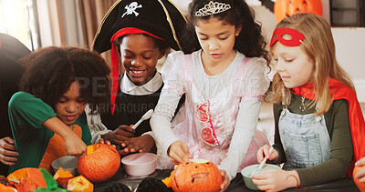 Buy stock photo Children, halloween and group with pumpkin carving, decoration and creativity for costume party. People, kids and vegetables for lantern, art and happy with celebration for festive event at house