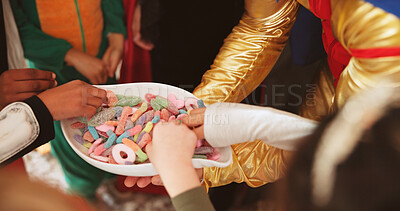 Buy stock photo Halloween, hands and kids with candy bowl, celebration and. social gathering with tradition. Home, group and children with sugar treat, giving and costume party with spooky season, hungry and holiday