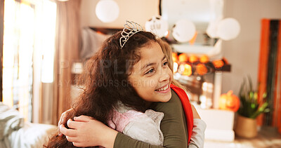 Buy stock photo Friends, hug and child with smile, halloween and happy for celebration, bonding and hangout in home. Kids, embrace and costumes for tradition on holiday, spooky season or fantasy in lounge and house