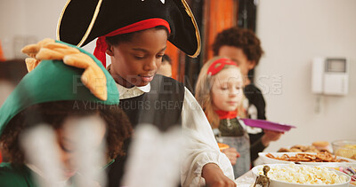 Buy stock photo Halloween party, food and kids with boy, celebration and hungry with tradition. Friends, home and children with snack, costume and sweets with treat, happiness and fantasy with fun, candy and popcorn