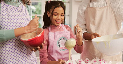 Buy stock photo Baking, cupcakes and child with parents in kitchen for learning, bonding or development in home. Smile, cooking and girl kid with mother and father for preparing dessert together on weekend in house.