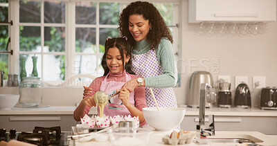 Buy stock photo Baking, bonding or learning with mother and daughter in kitchen of home together for pastry recipe. Cooking, cupcakes and smile with single parent woman teaching girl child how to bake in apartment