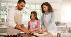 Baking, cookies and child with parents in kitchen for learning, bonding or development in home. Smile, cooking and girl kid with mother and father for preparing biscuits together on weekend in house.