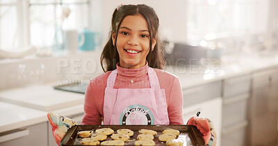 Buy stock photo Happy, baking and portrait of child with cookies in kitchen for learning, skills or development. Smile, baker and girl kid with pride for biscuits or dessert with achievement on weekend in home.