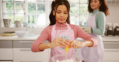 Buy stock photo Baking, eggs or learning with mother and daughter in home kitchen together for pastry recipe. Cooking, cracking and ingredients with single parent woman teaching girl child how to bake in apartment