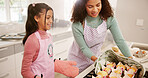 Baking, mother and girl in kitchen, help and bonding together with hobby, learning and recipe. Home, happy family and mama with daughter, parent and teaching with skills, cooking and ingredients