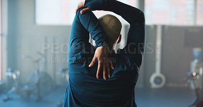 Buy stock photo Woman, back and stretching with arm in gym for workout preparation, fitness or flexibility. Active, female person or getting ready with warm up for start, physical exercise or training in health club