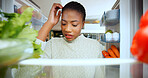 Woman, thinking and confused at fridge in home, choice and scratch head for food in morning. African person, decision and check shelf for healthy diet, ingredients and pov in kitchen at apartment