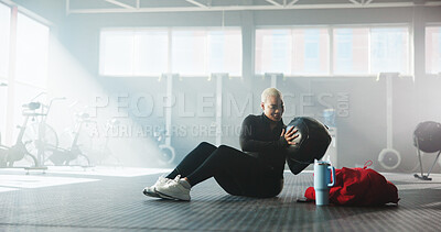Buy stock photo Abdominal, fitness and medicine ball with black woman on gym floor for physical activity. Core, exercise and weightlifting with athlete in health club for challenge, development or performance