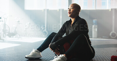 Buy stock photo Woman, medicine ball and break at gym for fitness recovery, breathing and endurance challenge. Equipment, african person and tired on floor for exercise fatigue, pause training and rest from workout