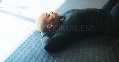 Buy stock photo Breathing, woman and resting on floor in gym, break and complete workout in morning, calm and peace. Relax, fitness or wellness for African person in health club, stress relief and done with exercise