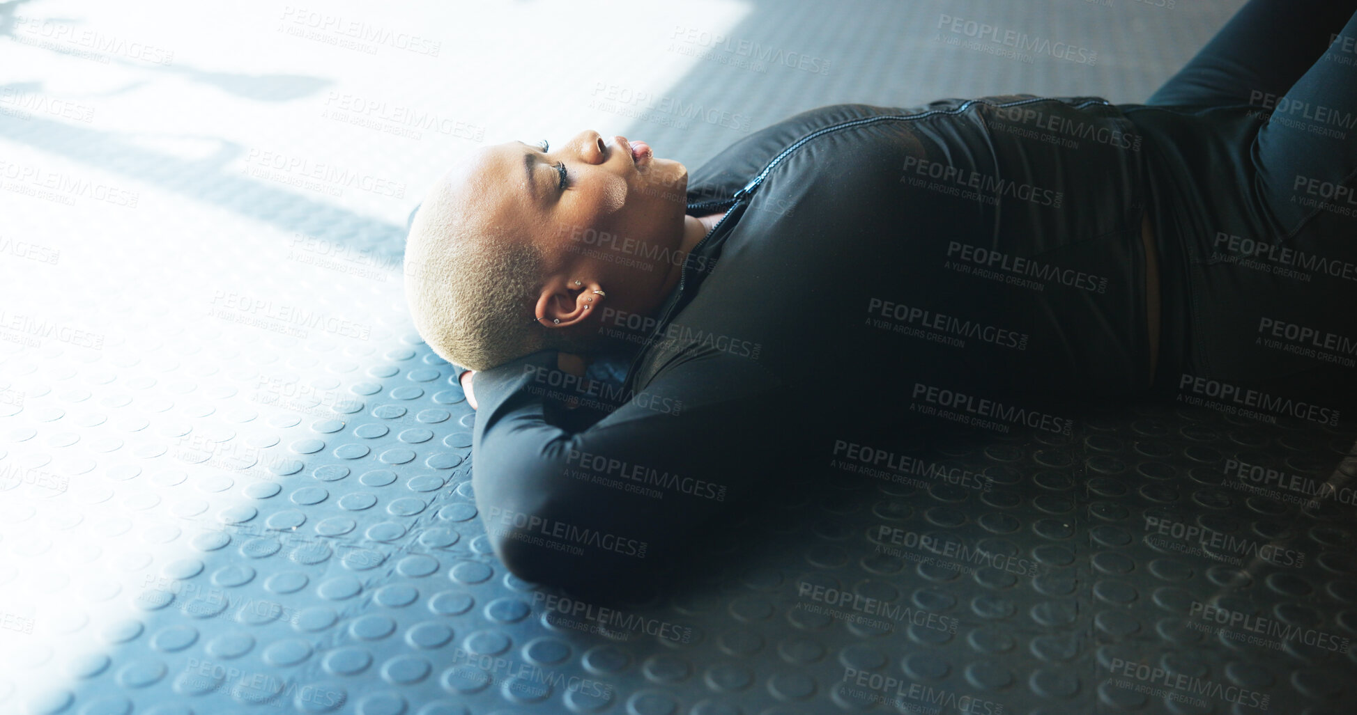 Buy stock photo Breathing, woman and resting on floor in gym, break and complete workout in morning, calm and peace. Relax, fitness or wellness for African person in health club, stress relief and done with exercise