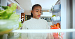 Woman, thinking and decision for food at fridge for cooking, nutrition and hungry in house. African person, confused and check shelf for healthy diet, ingredients and pov in kitchen at apartment