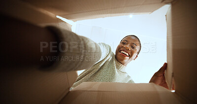 Buy stock photo Black woman, open box and happy with POV in home, low angle or ecommerce for product, order or delivery. Person, excited and smile with cardboard package, parcel and online shopping at apartment