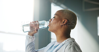 Buy stock photo Woman, fitness and drinking with water bottle in gym for hydration, recovery or break. Active, female person or thirst with aqua or natural mineral liquid for performance or energy in health club