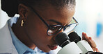 Black woman, scientist and microscope in laboratory for research, cure development and analysis. Microbiology, science equipment and medical experiment for study, biotechnology innovation and test